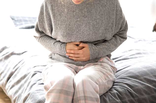 tight stomach causes