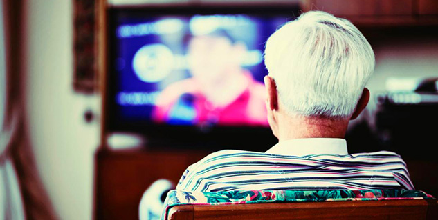 old man watching tv