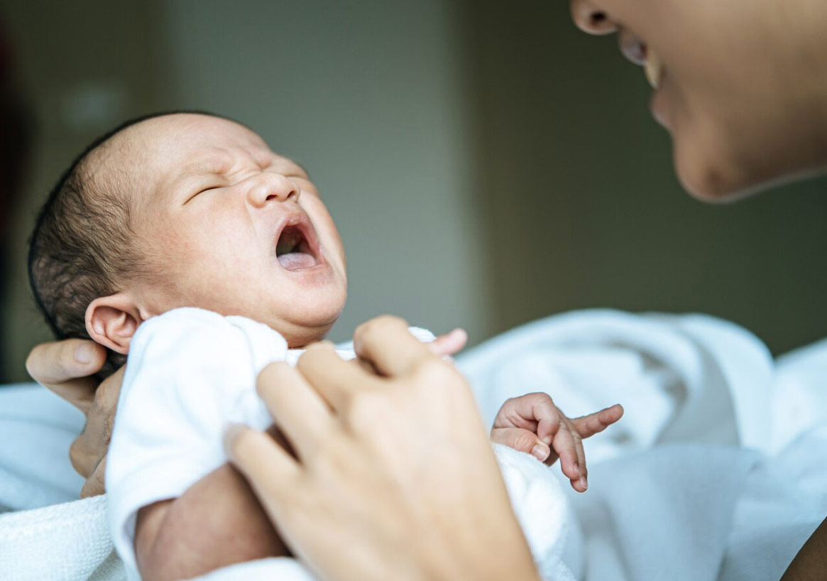 baby sticking tongue out