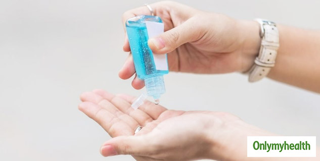 using hand sanitizer