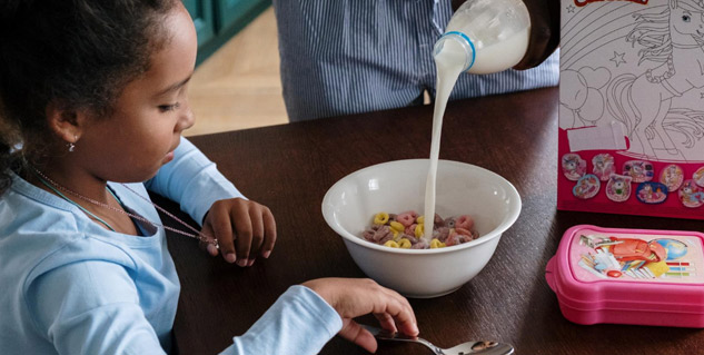 child_having_milk_cereals
