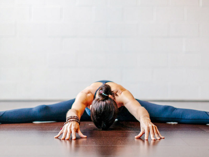 7 Yoga Moves to Relieve Back Pain - Camille Styles