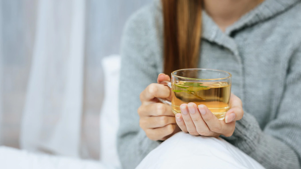 man drinking green tea