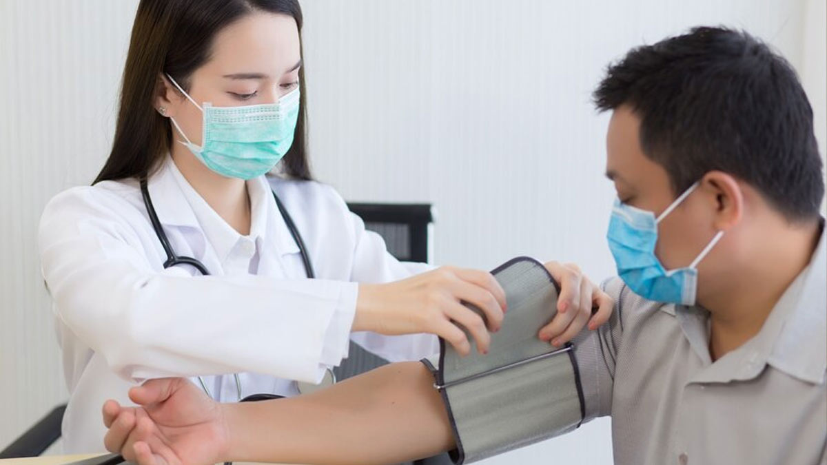 checking blood pressure