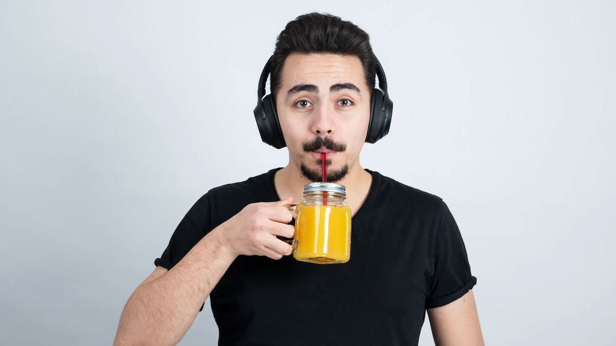 premium-ai-image-a-glass-of-orange-juice-is-on-a-table-in-front-of-a