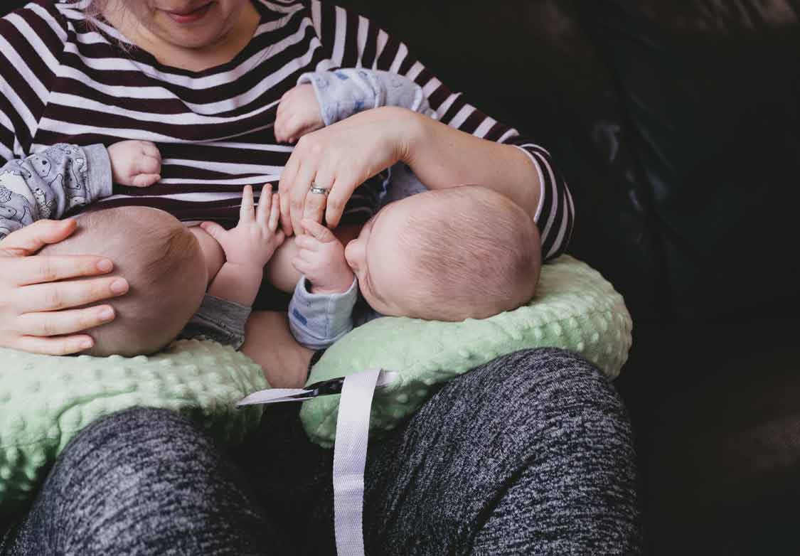 how to breastfeed twins