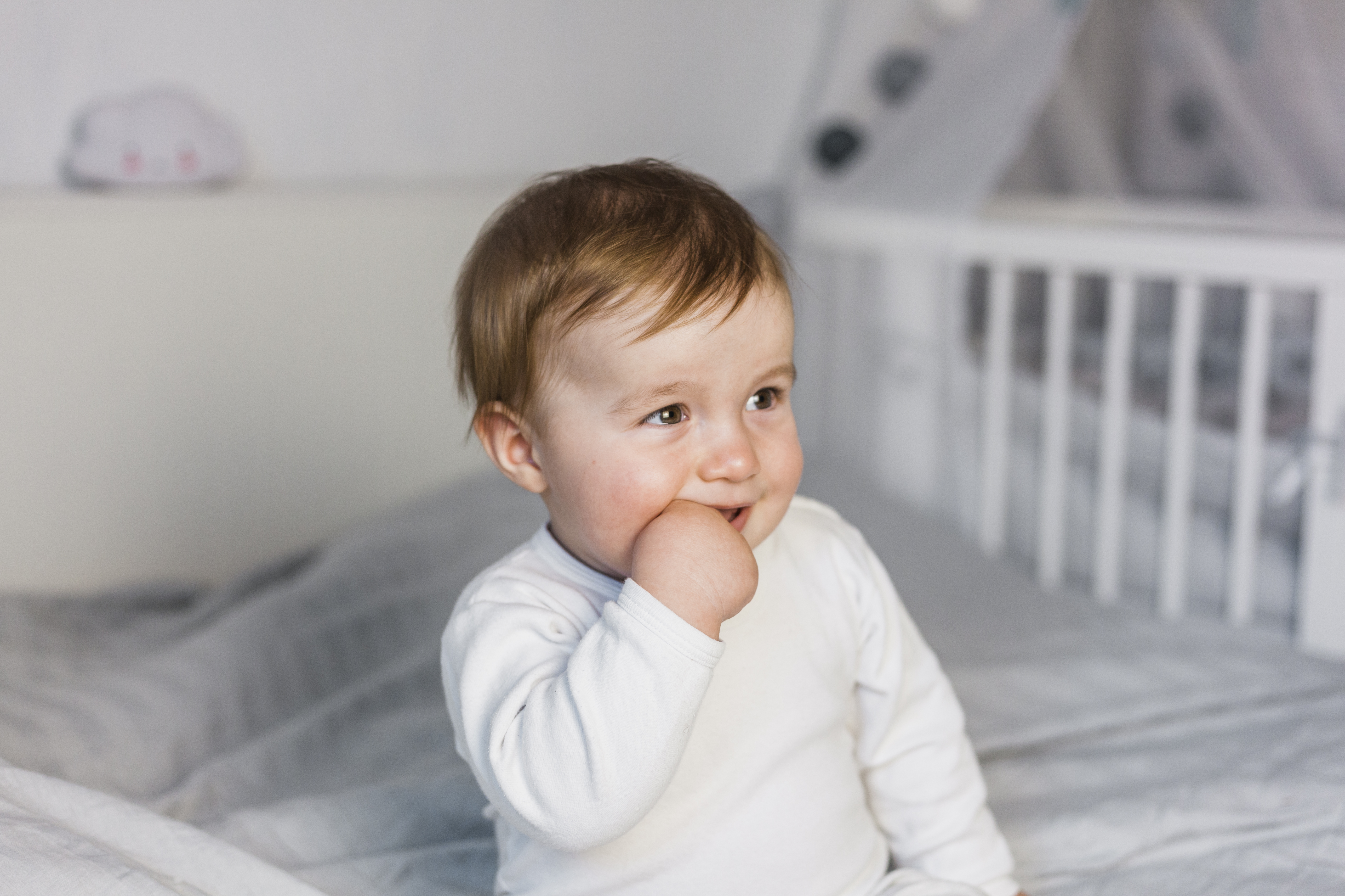 cute-blonde-baby-white-bed