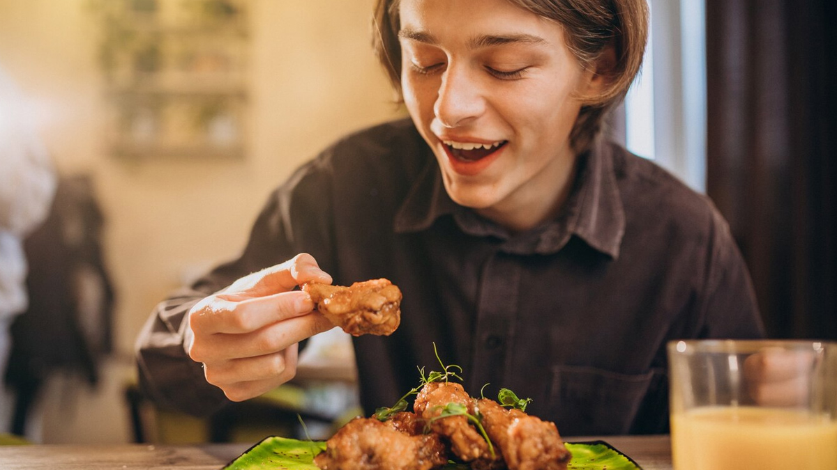 man eating with hands