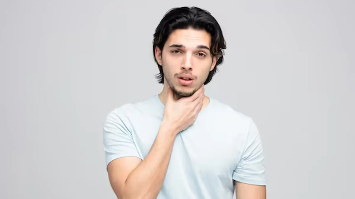 feeling something stuck in throat causes