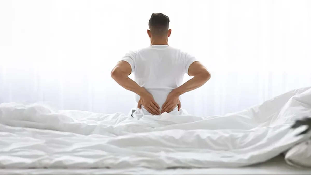 why does lower back pain occur right after waking up sleeping position can cause problem 1