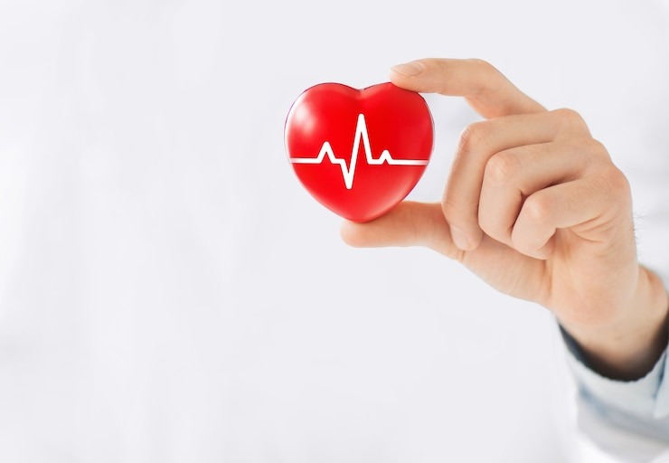 hand-holding-red-heart-with-ecg